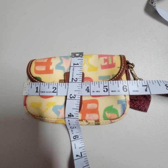 Dooney & Bourke Vintage Pouch Graffiti Canvas Leather Trim.